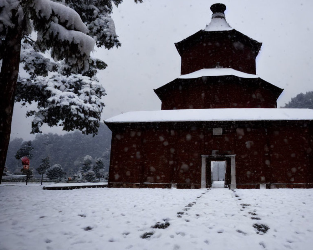 Traditional multi-tiered building with conical roof in snowy landscape.