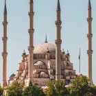 Grand Mosque with Multiple Domes and Tall Minarets in Clear Sky