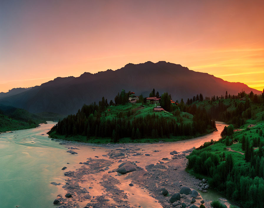 River winding through lush valley at sunrise with mountains, houses on verdant hill