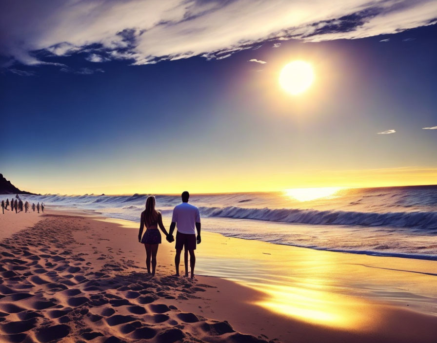 Couple walking on sandy beach at sunset with crashing waves and vibrant sky