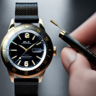 Luxury wristwatch and gold audio jack on dark background