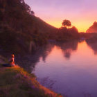 Tranquil sunset landscape by calm lake with vibrant skies.