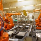 Robot-Dominated Factory Floor with Orange Robotic Arms