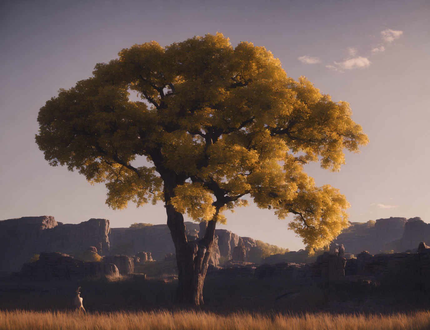 Person under vibrant tree with golden canopy and distant rock formations.