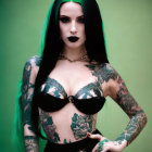 Vibrant green-haired woman with tattoos in black bralette against green background