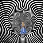 Concentric Black and White Circles with Central Blue Orb Optical Illusion