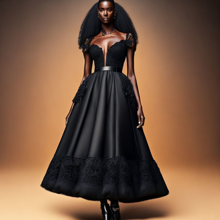 Woman in elegant black off-the-shoulder gown with lace detailing against warm backdrop