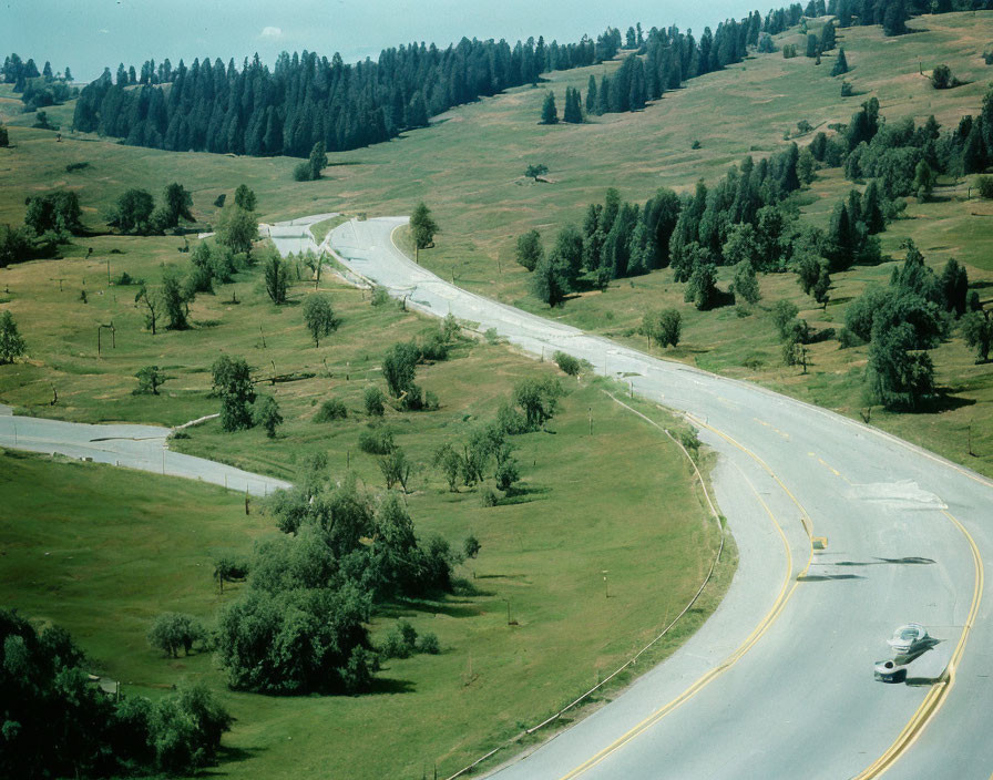 Scenic winding road through lush green landscape