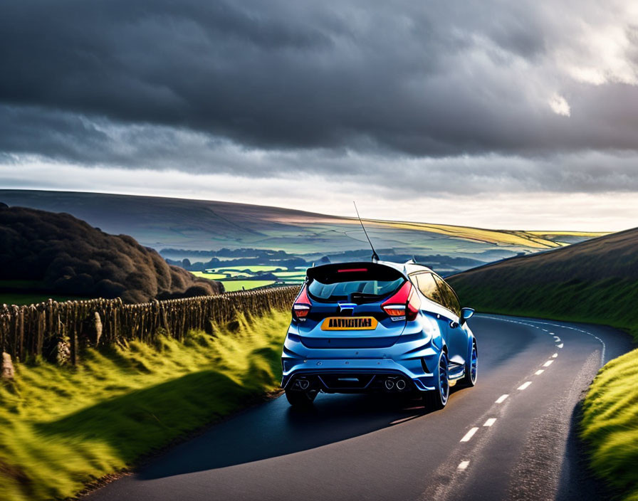 Blue hatchback car driving on curvy road through rolling green hills under dramatic cloudy sky