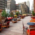 Rooftop lounge with plush seating and cityscape view