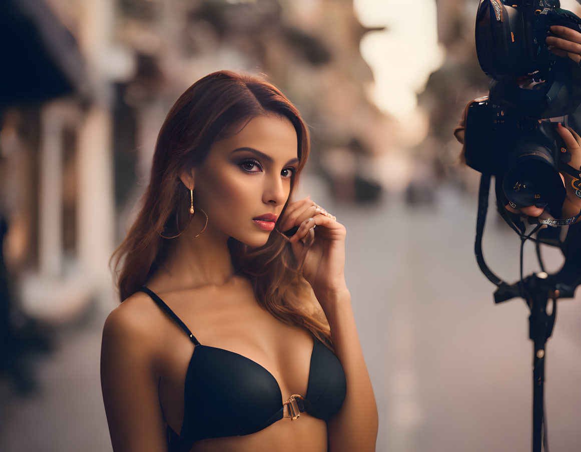 Woman in black bikini posing with camera person on city street at dusk