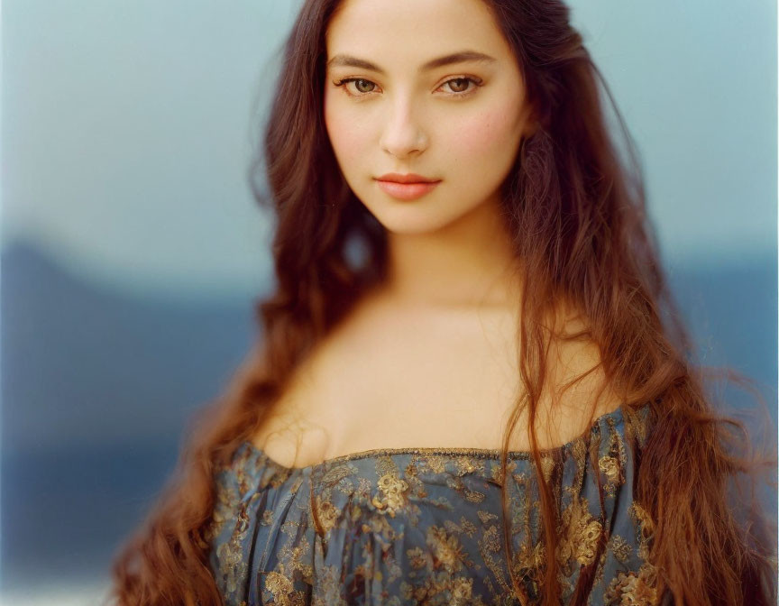 Long Wavy Hair Person in Off-Shoulder Top on Soft-Focus Background