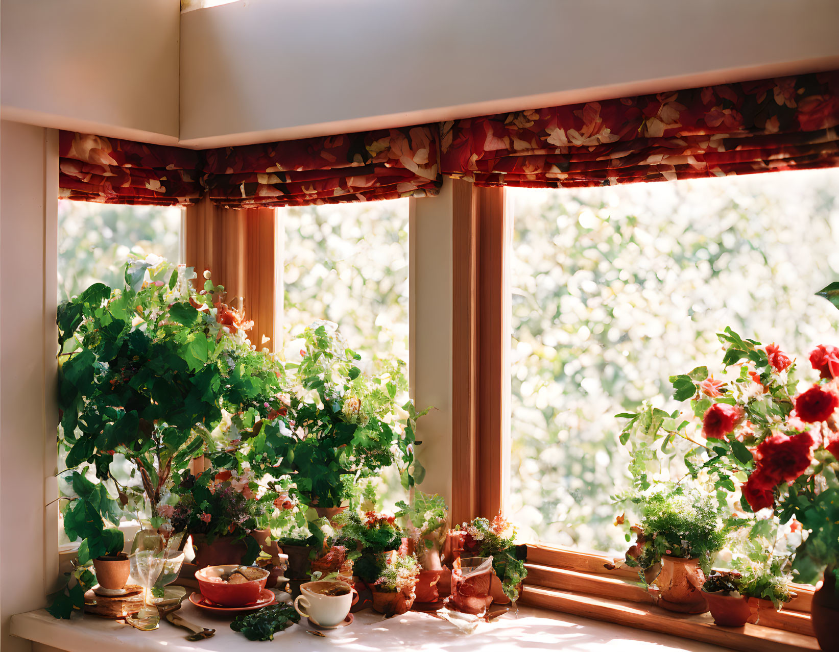 Sunlit window nook with potted plants and greenery view