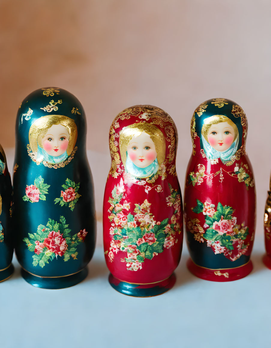 Traditional Russian Matryoshka dolls with floral patterns on pastel background