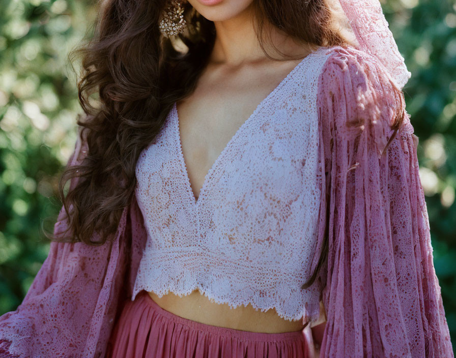 Delicate pink lace top with sheer sleeves in greenery