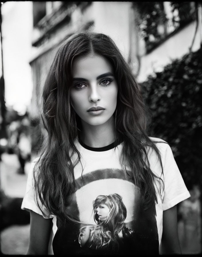 Monochrome portrait of young woman in graphic print t-shirt