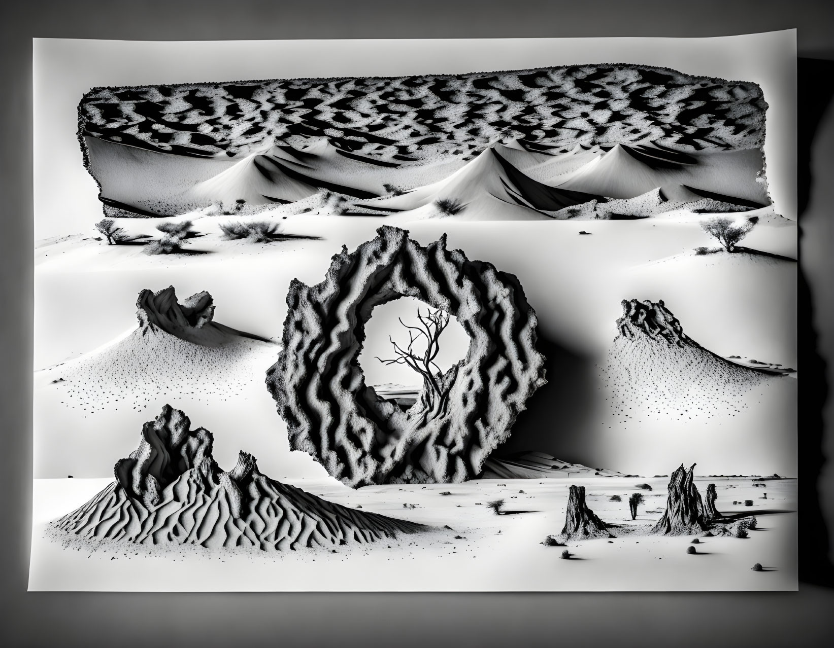 Monochrome desert landscape with rock formations, lone tree, and sand dunes