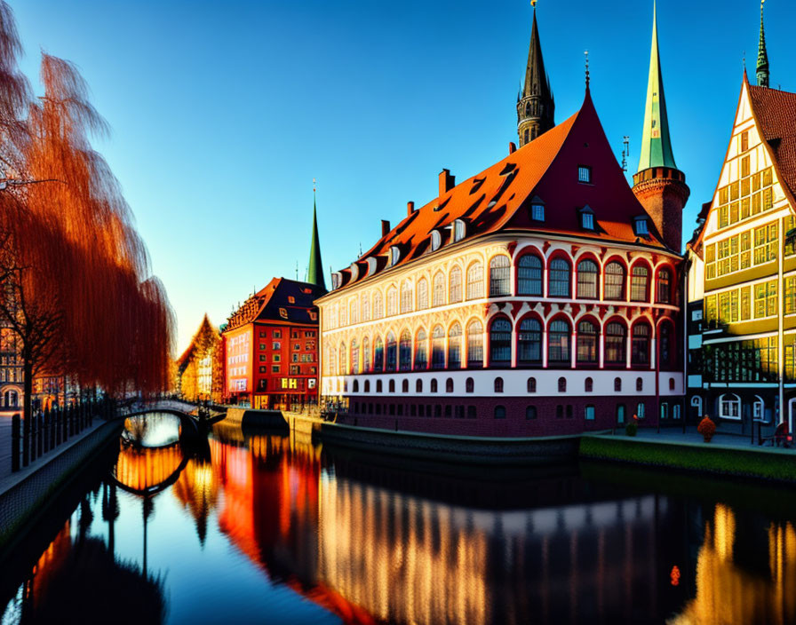 Scenic historic buildings by calm river at sunset