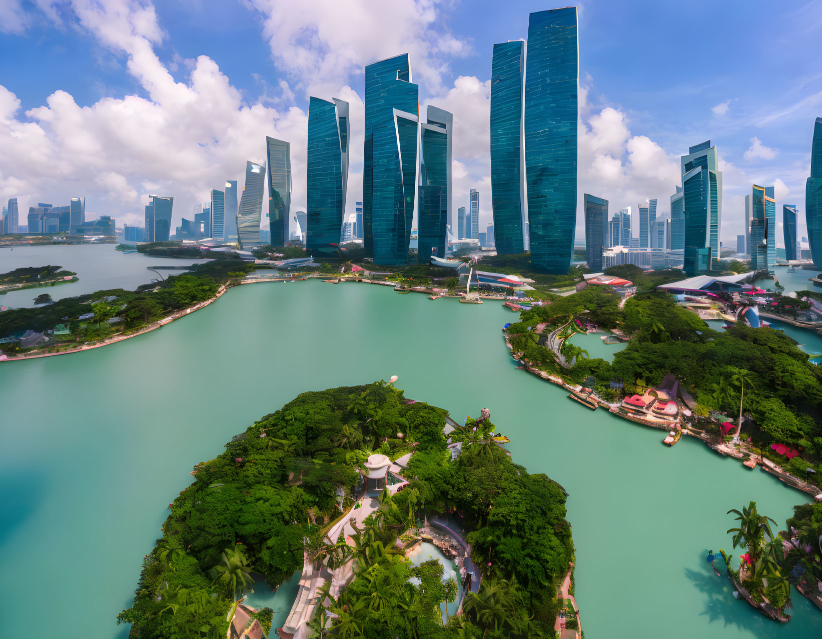 Modern city skyline with skyscrapers by turquoise bay and lush greenery