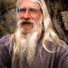 Fantasy-themed portrait of an individual with blond dreadlocked hair and ornate jewelry in a forest setting