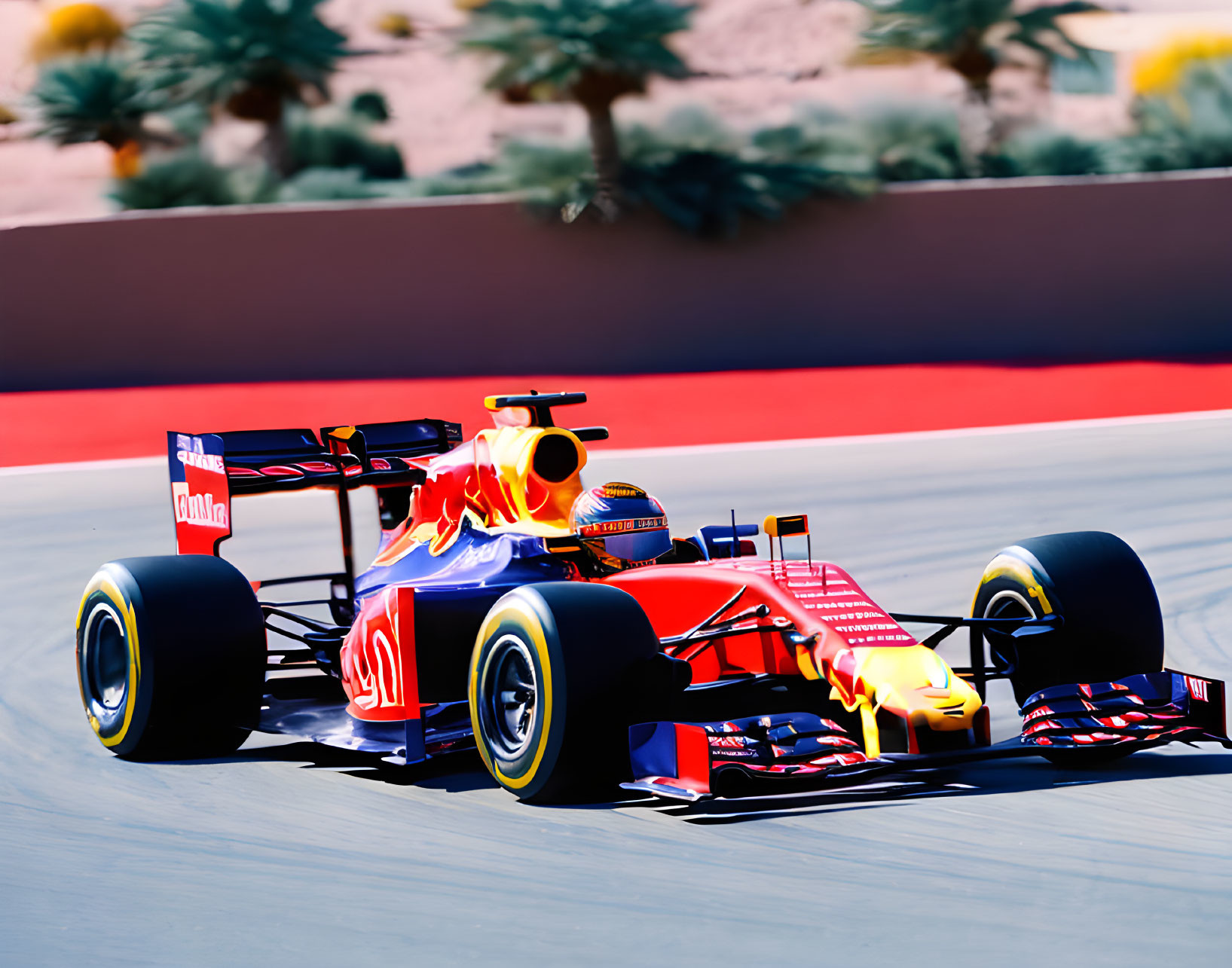 Speeding Red and Blue Formula 1 Car on Racetrack with Tire Motion Blur