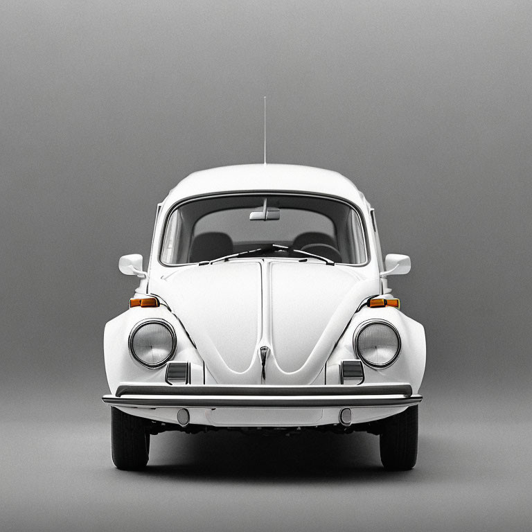 Vintage White Volkswagen Beetle Front View on Gray Background