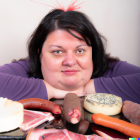 Colorful portrait of man with dark hair, red ribbon, and food still life.