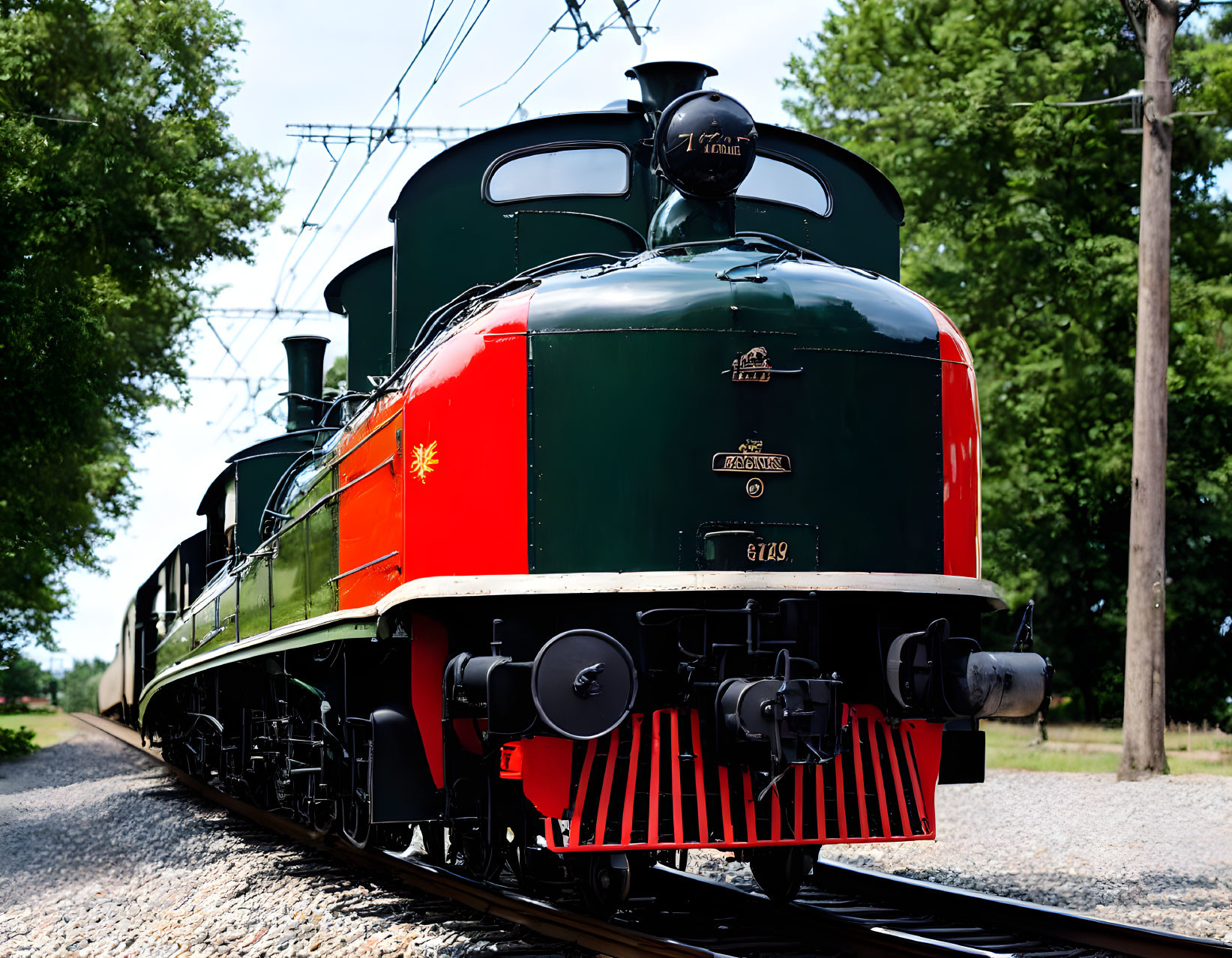 Vintage Green Steam Locomotive with Red Trimmings on Tracks