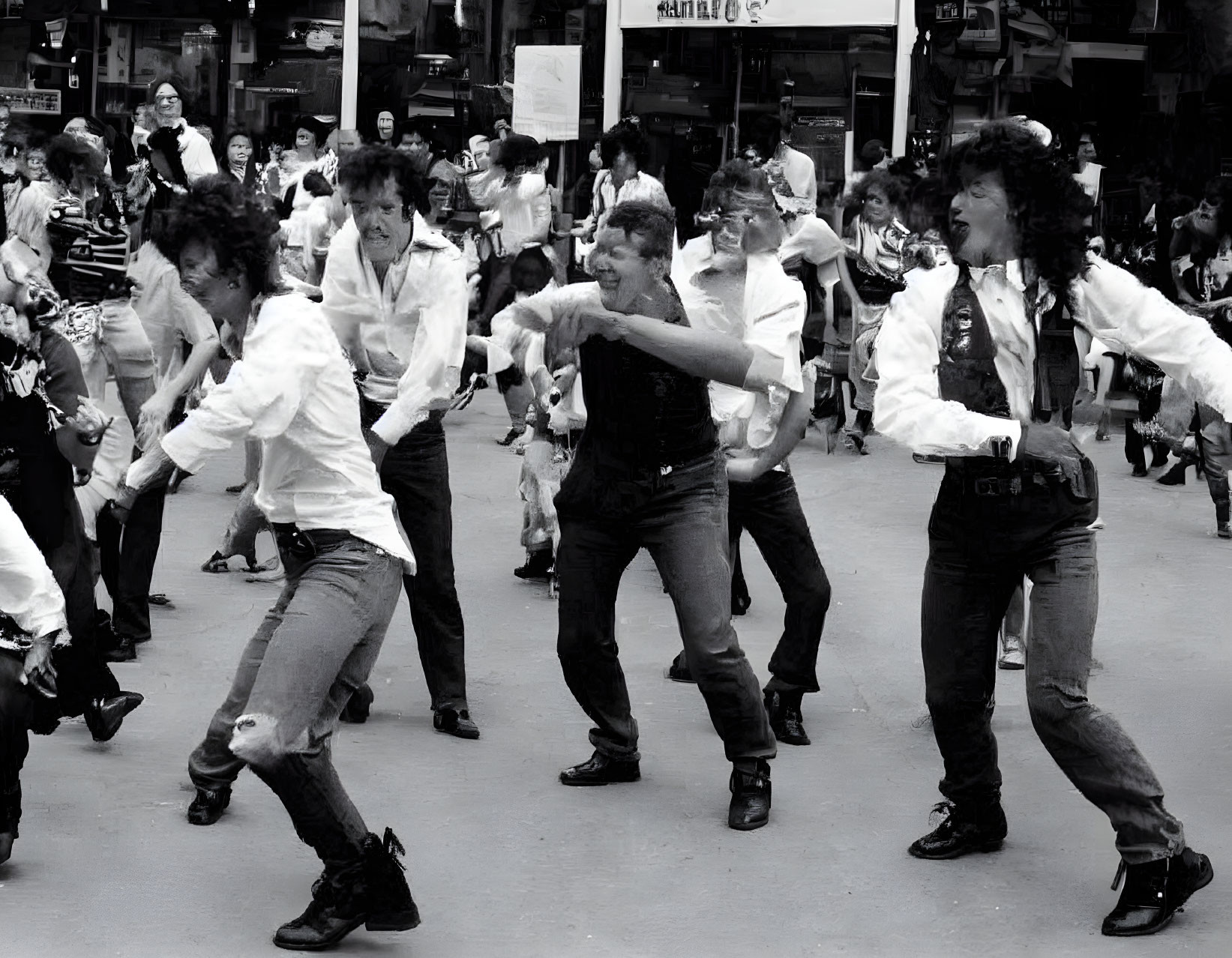 Group of People in White Shirts and Dark Pants Performing Coordinated Street Dance