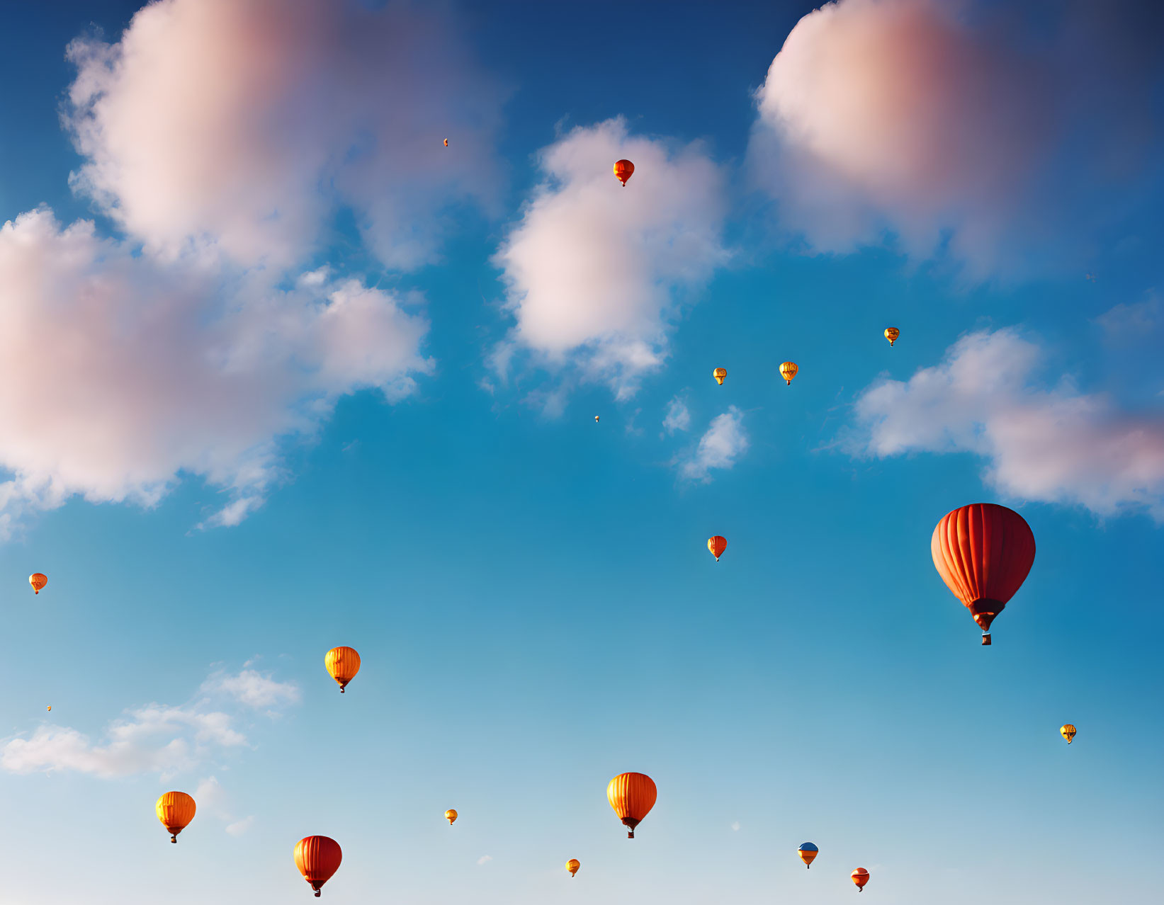 Sky with White Clouds and Hot Air Balloons in Various Sizes