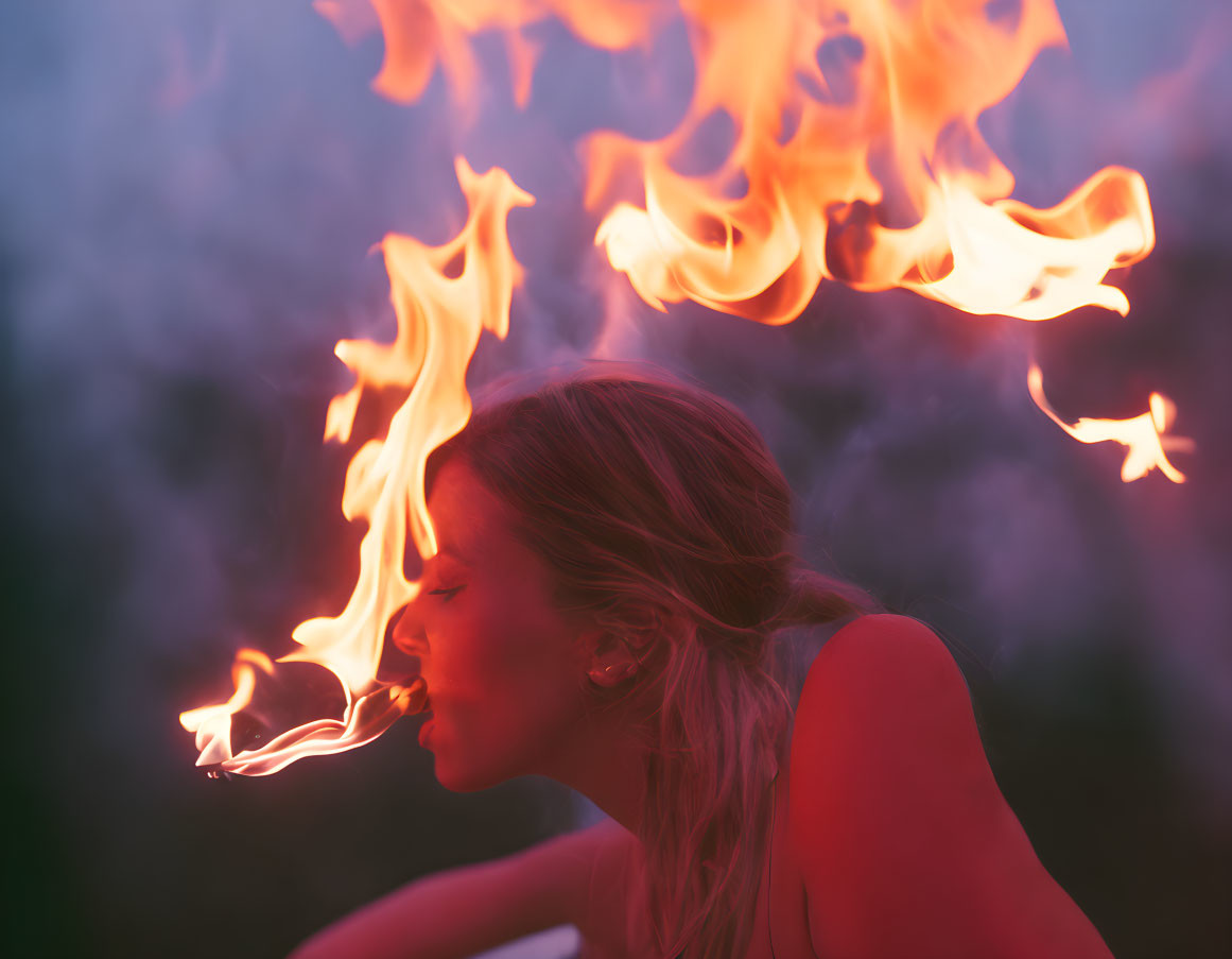 Woman exhales fire in dragon-like setting