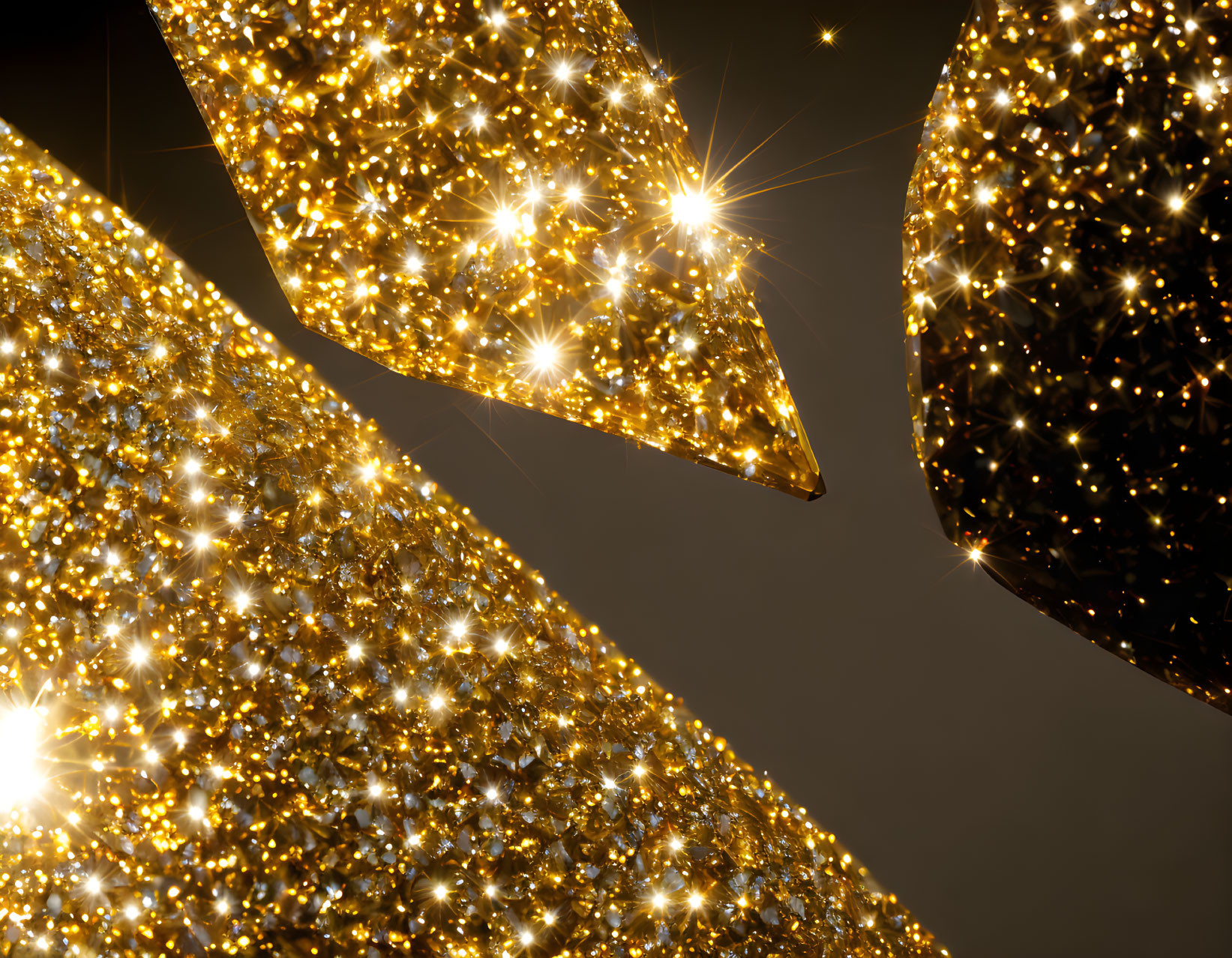 Shiny golden star-shaped decorations on dark background