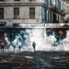 Individuals navigating debris-filled street amidst rising smoke and dilapidated buildings.