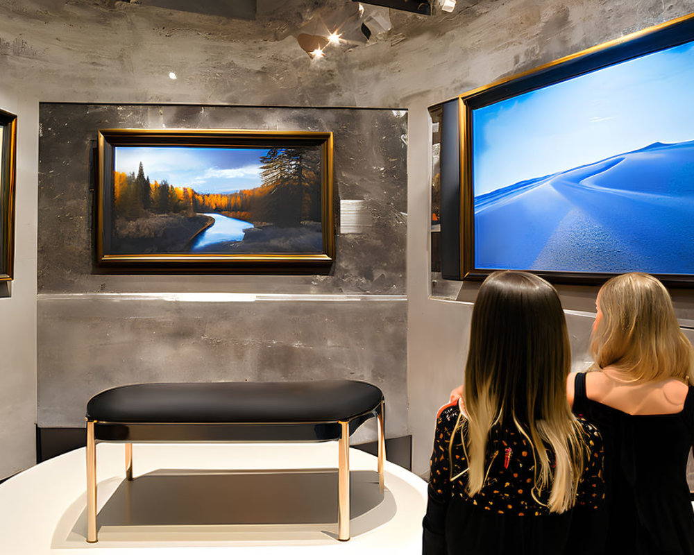 Gallery visitors admire river and desert landscape paintings with bench.