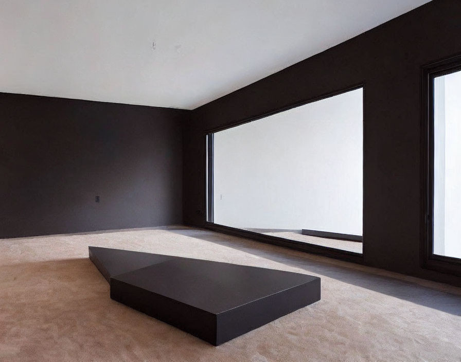 Dark-walled minimalist room with large windows and low-lying black platform