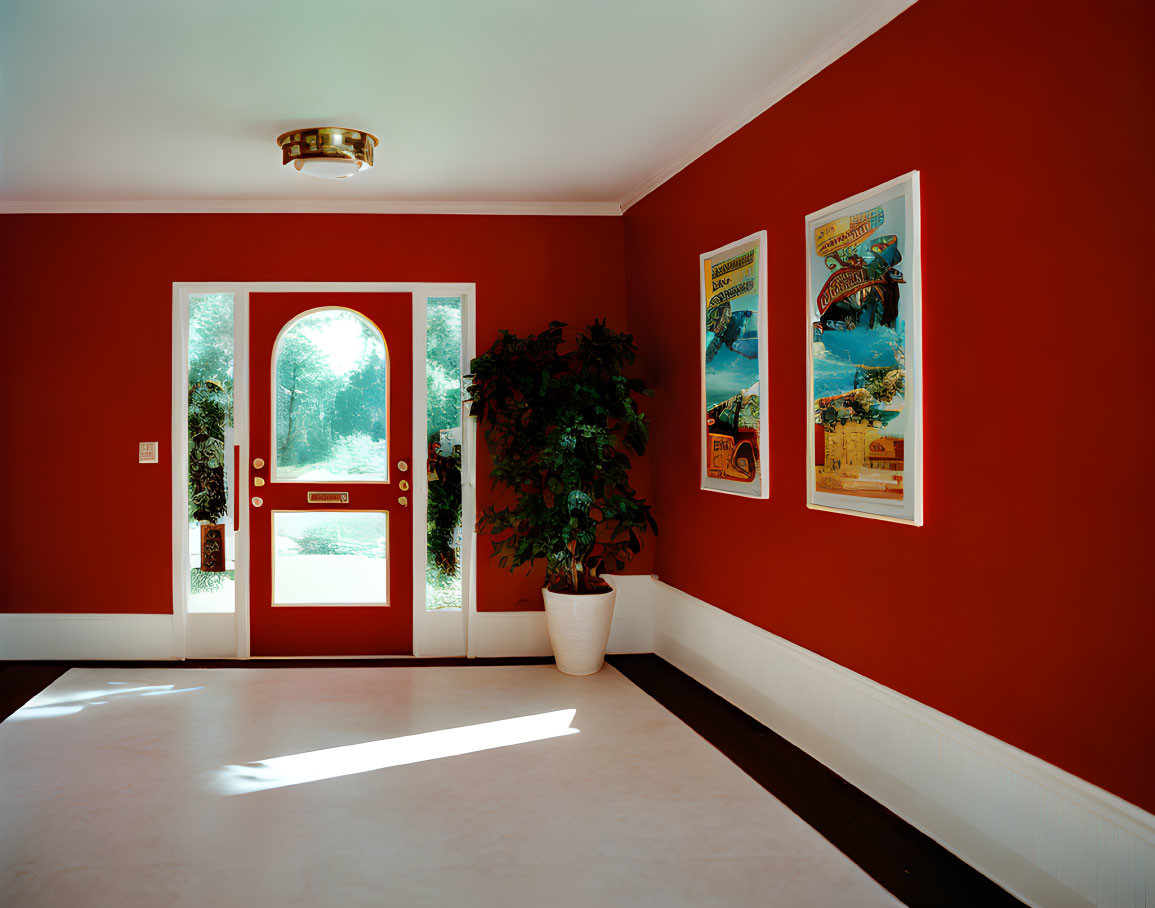 Bright Room with Red Walls, Vintage Posters, Plant, and Double Glass Doors