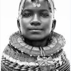 Portrait of woman with headscarf, jewelry, and bindi