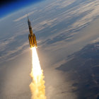Rocket launching into space with bright flames against Earth's horizon