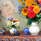 Vibrant floral patterns on woman's face with colorful flowers in vases