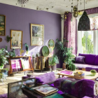 Luxurious Purple Room with Gold-Trimmed Furniture and Arched Windows