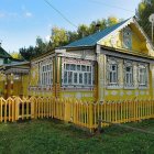 Charming cottage with colorful garden and wooden fence