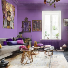 Luxurious Purple and Gold Living Room Decor with Ornate Furniture and Intricate Wall Art