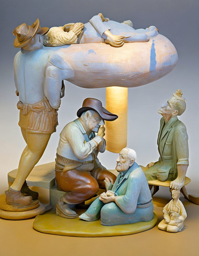 Sculpture of four figures on cloud with farming motif