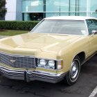 Vintage Gold Classic Car with Chrome Details and White-Wall Tires