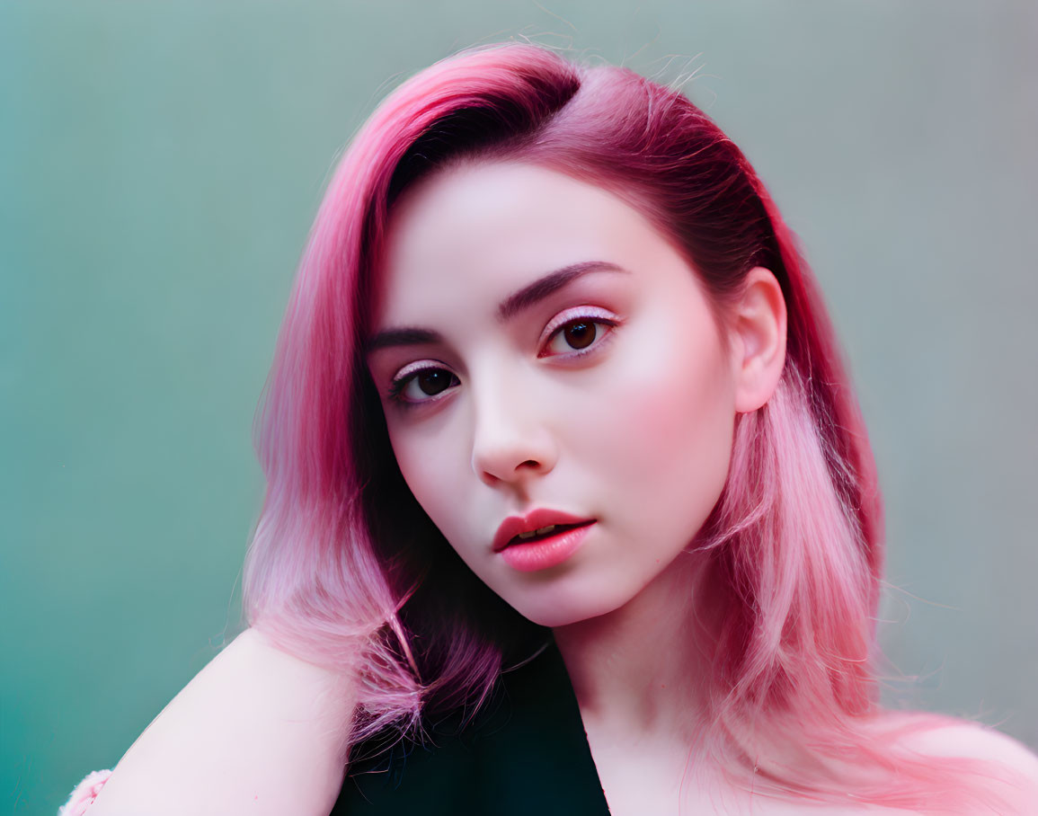 Pink-haired woman with subtle makeup on teal background