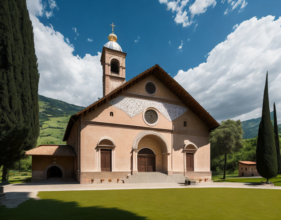 Gold dome church with bell tower in lush greenery landscape.