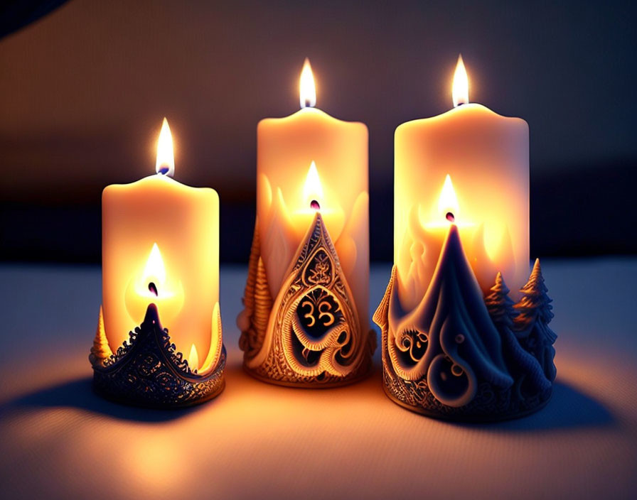 Intricately designed lit candles on dark background