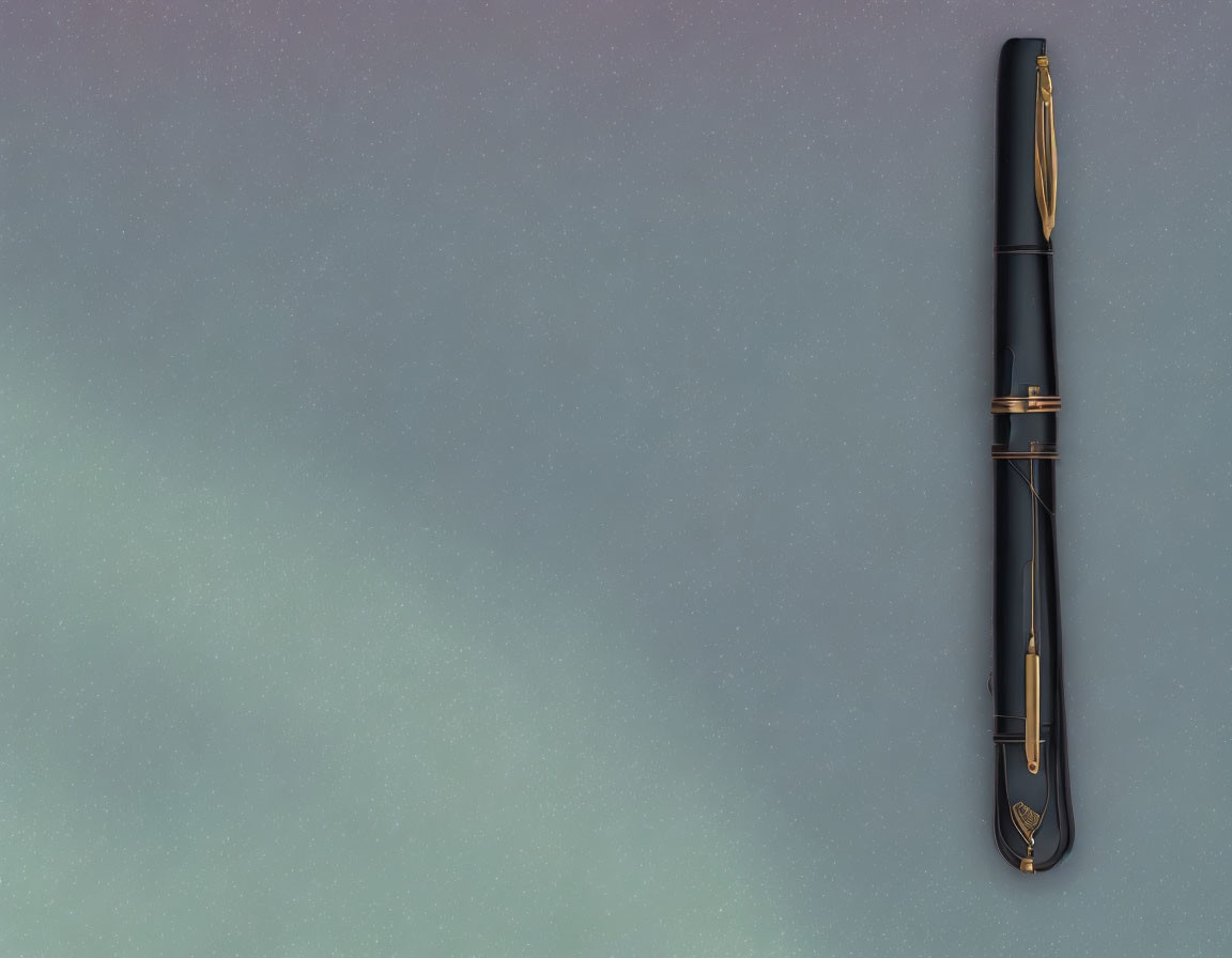 Black Fountain Pen with Gold Accents on Gradient Background