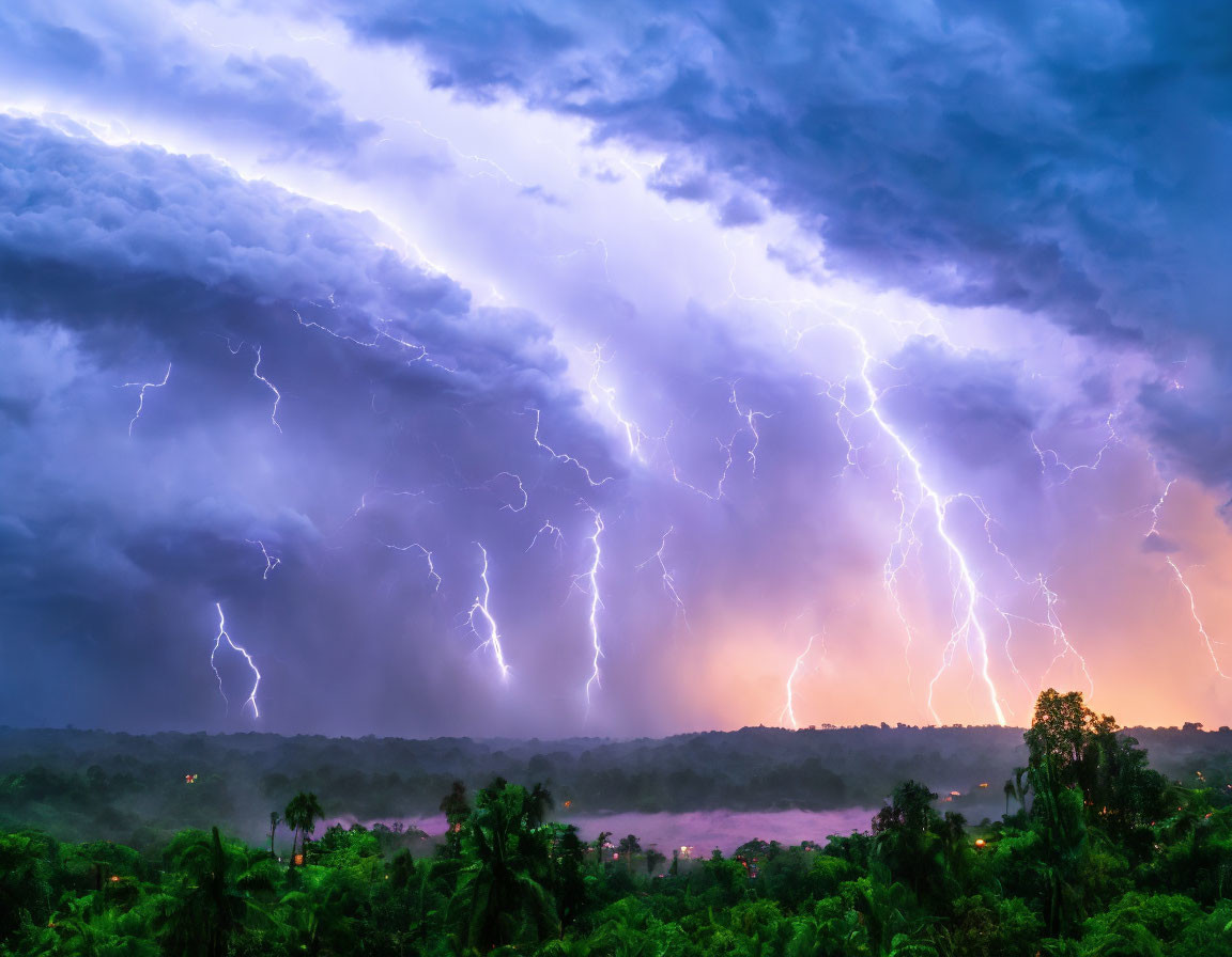 Intense thunderstorm with lightning strikes over forested landscape