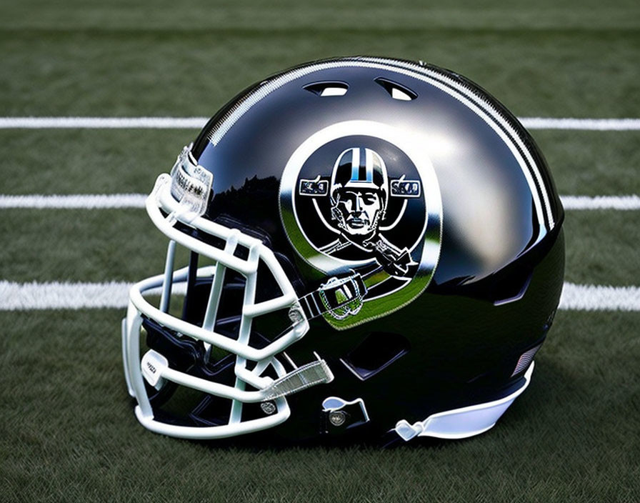 Black sports helmet with face mask and silver logo featuring football field design